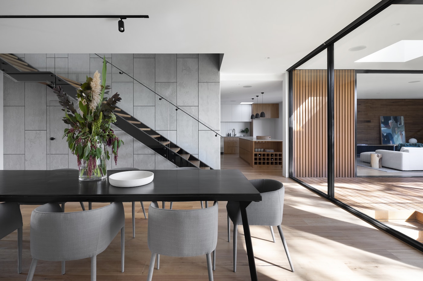 Dining room — Dark table, open stair